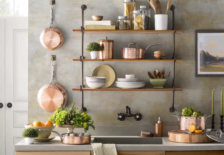 industrial clean kitchen sink with exposed shelving and copper details